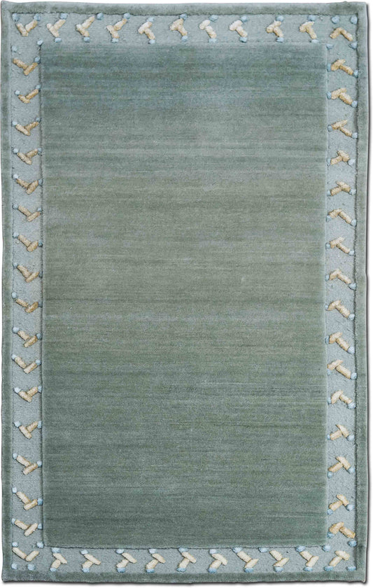 Tufenkian –  5 ft x 3 ft – 100% wool – brown cream trim