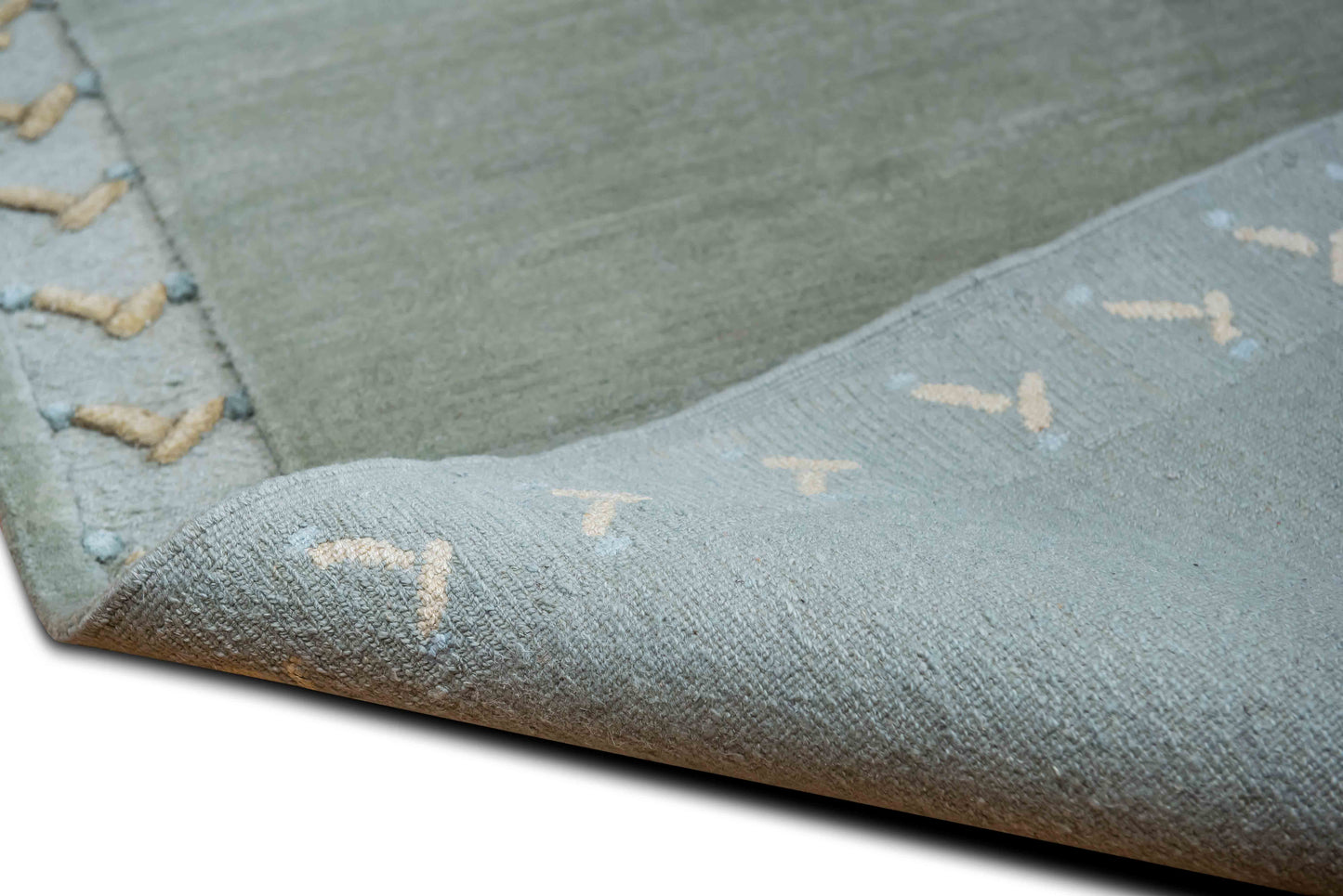 Tufenkian –  5 ft x 3 ft – 100% wool – brown cream trim